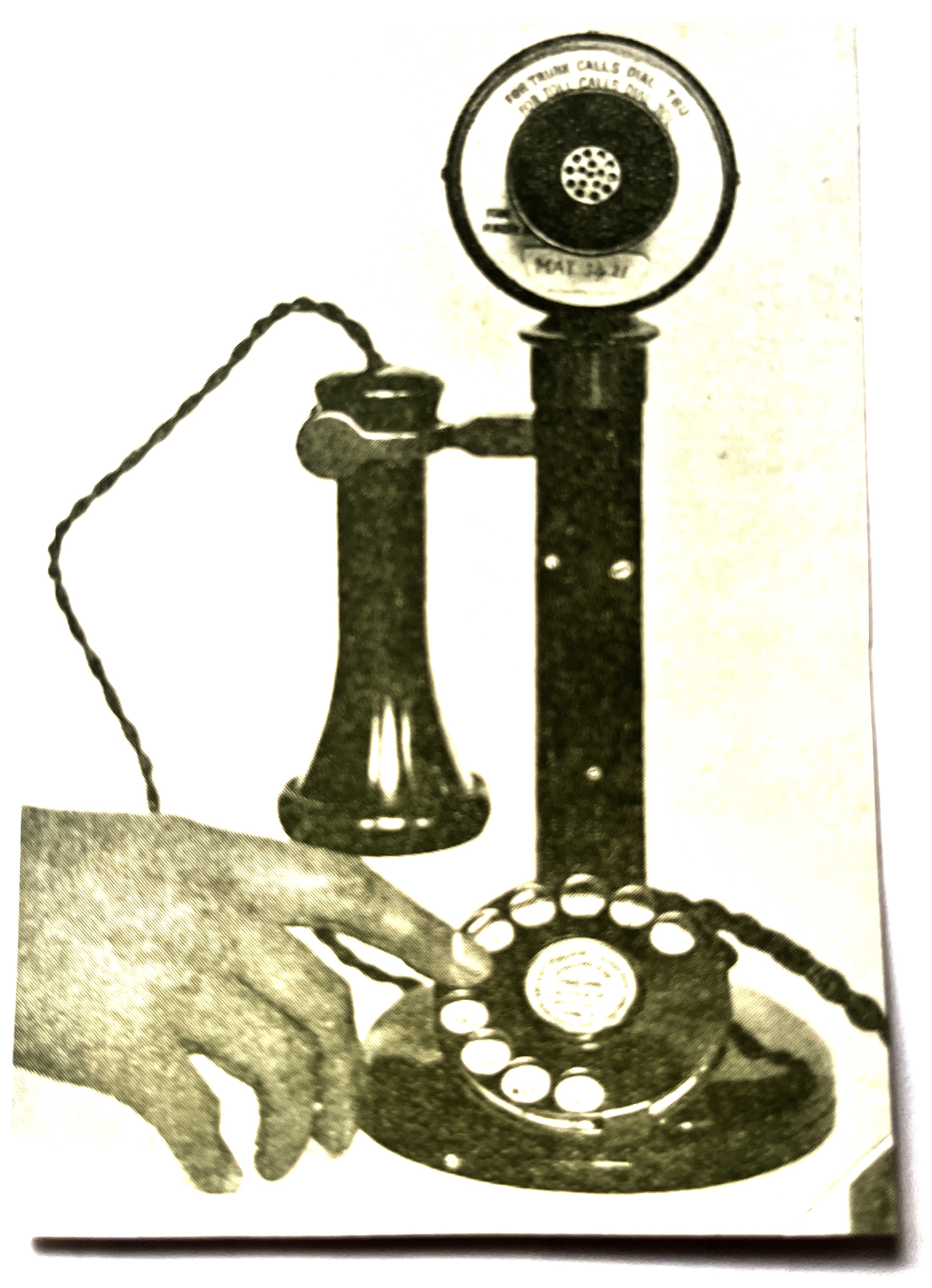 Photograph of an old-fashioned 'candlestick' style telephone.
